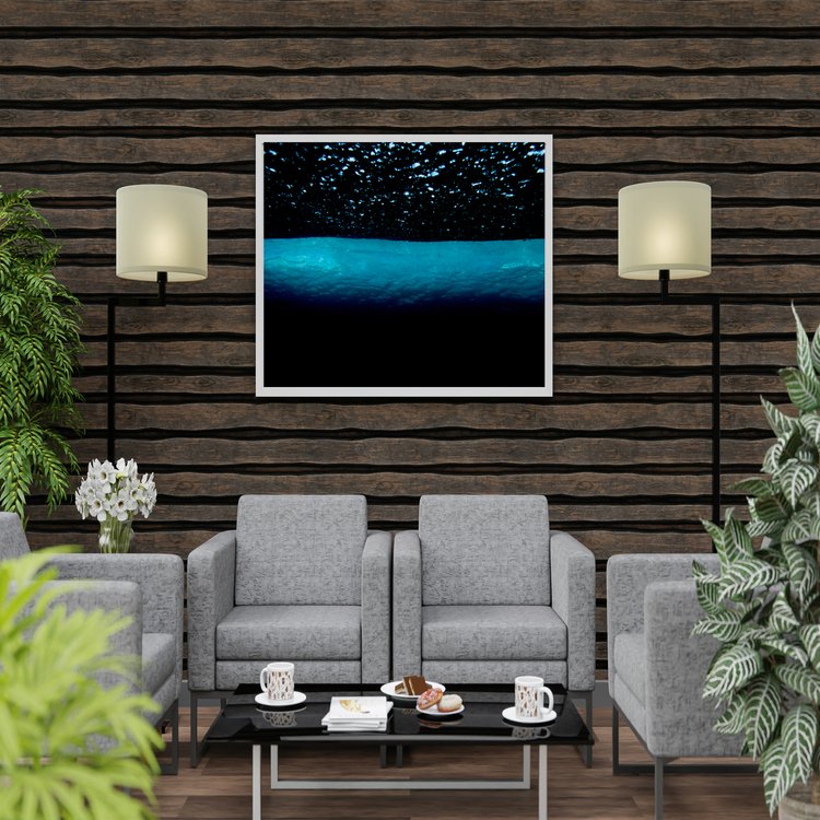 Just enough sunlight hits the top surface of this wave roll to illuminate it whilst the underside sits in darkness.  Bubbles float above the waveroll like stars in the night sky.