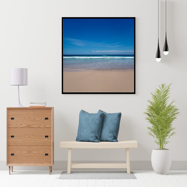 Exhale is a beach scene taken on a day when the surf was quiet. The image captures the sandy beach which leads to the calm waters edge and onwards to the peaceful blue sky.